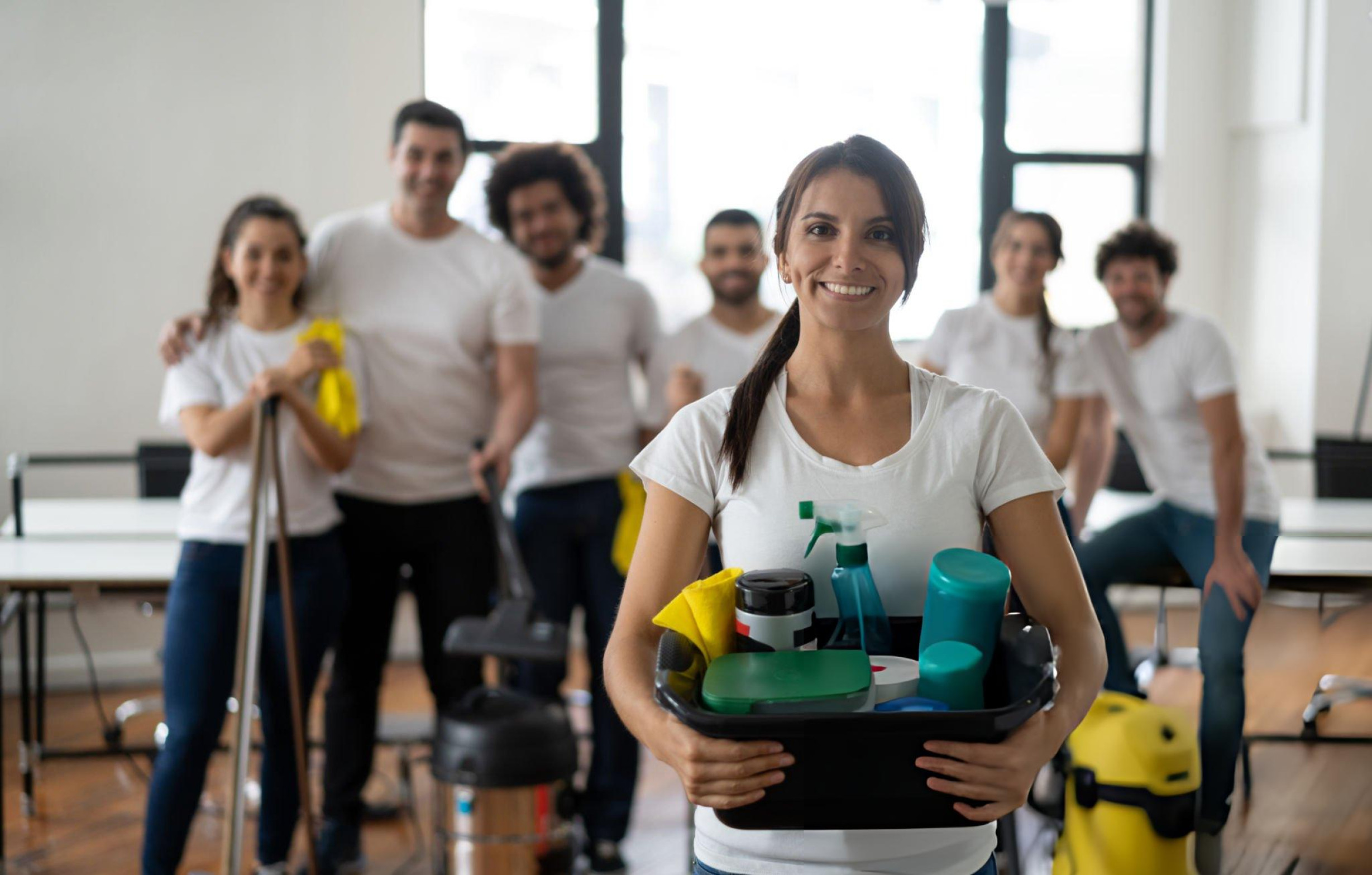 People collaborating in a room with cleaning supplies, focused on maintaining cleanliness in Brisbane.--------------------------------------------------------------------------------------------------------------------------------------------------------------------------------------------------------------------------------------------------------------------------------------------------------------------------------------------------------------------------------------------------------------------------------------------------------------------------------------------------------------------------------------------------------------------------------------------------------------------------------------------